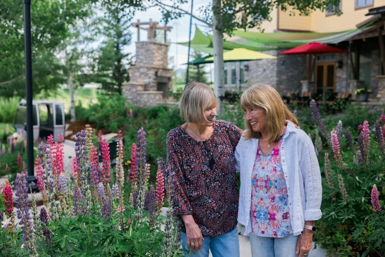 Two happy women in garden at Casey's Pond in Steamboat Springs, CO
