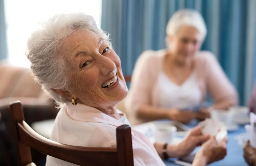Senior women smiling and playing a game